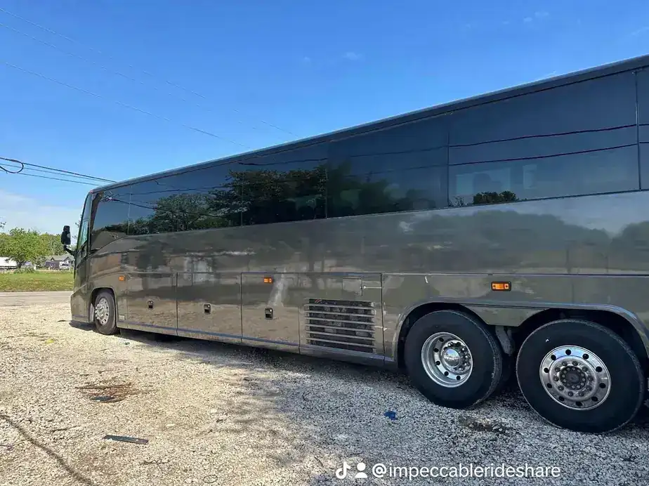 Grey charter coach parked in the sun
