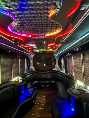 Lights glowing along the party bus ceiling