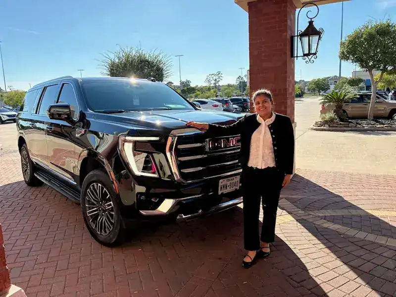 Shelly Castle standing beside her black GMC SUV